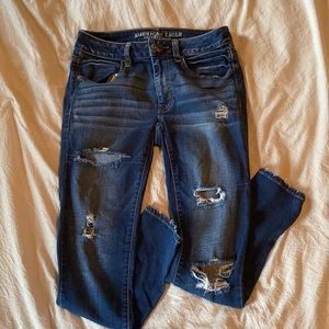 AE ripped mid waist jeggings